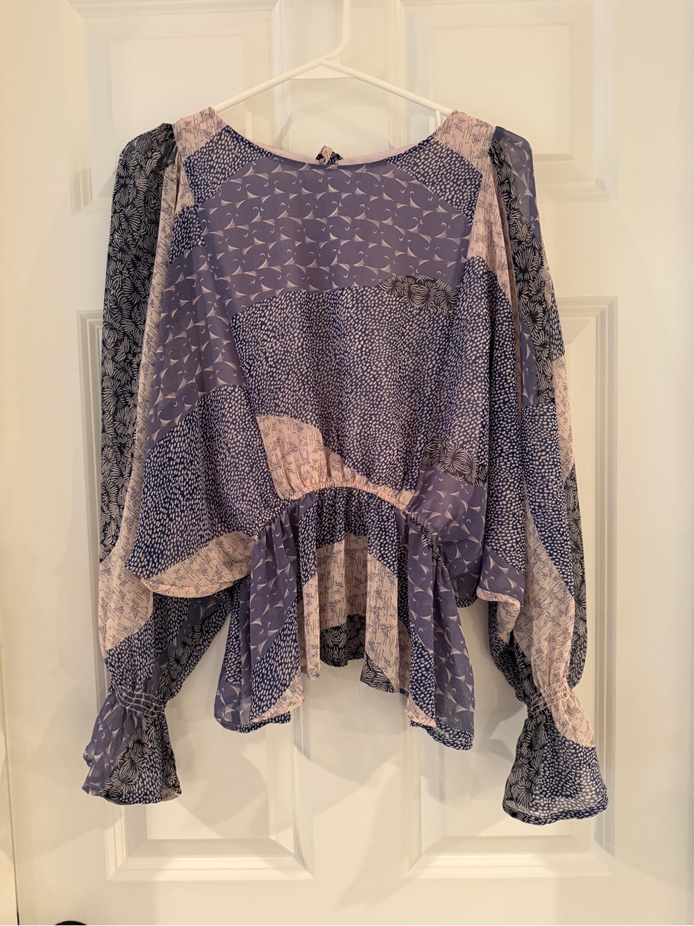 BB Dakota Patchwork Blouse. Flowing Sleeves make this a dressier top.
